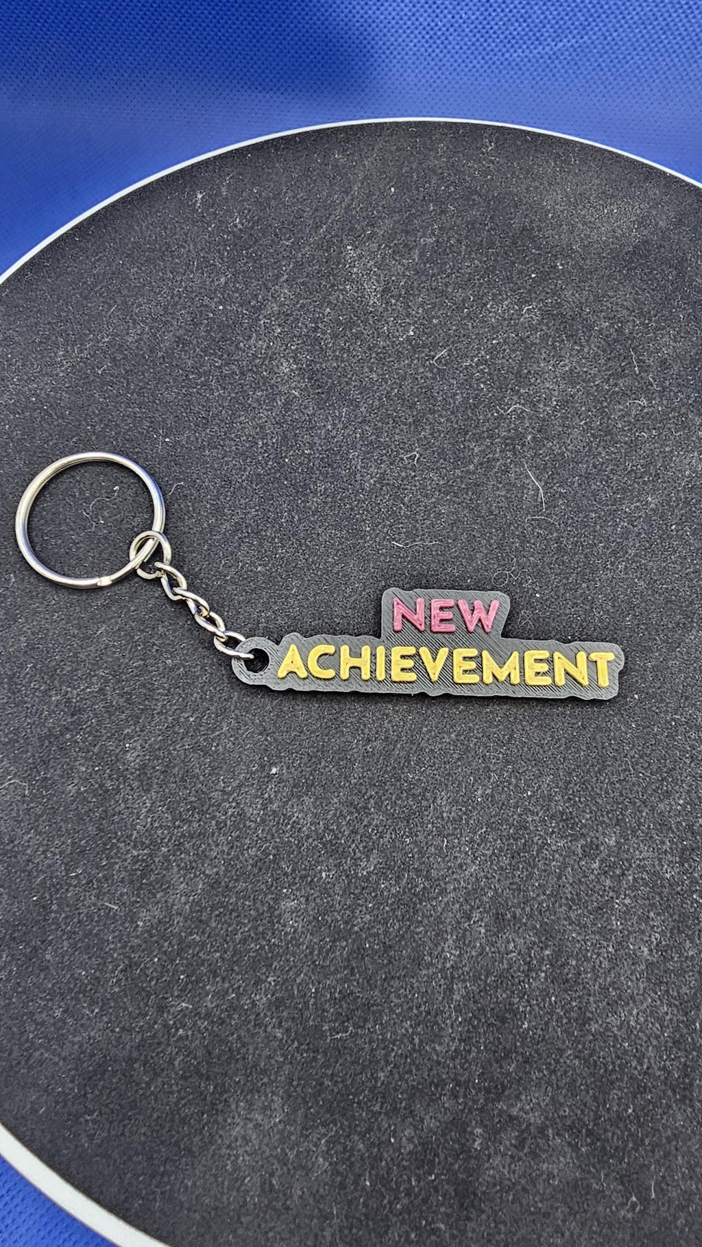 Dungeon Crawler Carl Quote Keychain – “New Achievement” – Keychain – Fantasy Book Gift