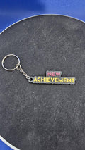 Dungeon Crawler Carl Quote Keychain – “New Achievement” – Keychain – Fantasy Book Gift